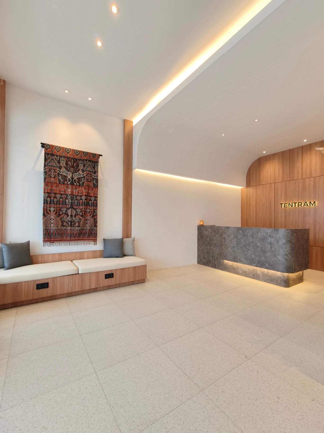 Lobby with ikat tapestry and reception desk